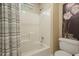 Bathroom with a shower-tub combo and neutral tones at 921 Laurel Crest Dr, Woodstock, GA 30189