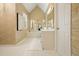 Elegant bathroom with unique wallpaper, a large vanity, and a soaking tub at 921 Laurel Crest Dr, Woodstock, GA 30189
