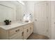 Well-lit bathroom with a white vanity and neutral-colored walls and flooring at 921 Laurel Crest Dr, Woodstock, GA 30189