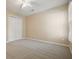 Tan bedroom with carpet, a window and a closet at 921 Laurel Crest Dr, Woodstock, GA 30189