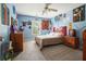 Eclectic bedroom with light blue walls, carpet, and unique decor at 921 Laurel Crest Dr, Woodstock, GA 30189