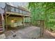 Multi-tiered wooden deck, ideal for outdoor relaxation amidst lush greenery at 921 Laurel Crest Dr, Woodstock, GA 30189
