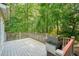 Deck with grill, perfect for outdoor cooking and entertaining with wooded views at 921 Laurel Crest Dr, Woodstock, GA 30189