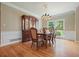 Cozy dining room with hardwood floors, a large window, and a classic china cabinet at 921 Laurel Crest Dr, Woodstock, GA 30189