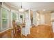 Bright dining room with hardwood floors, large windows, and a view of the staircase at 921 Laurel Crest Dr, Woodstock, GA 30189