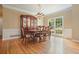 Formal dining area featuring hardwood floors, chair rail molding, and a large window at 921 Laurel Crest Dr, Woodstock, GA 30189
