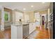 Charming kitchen island featuring granite countertops, stainless steel appliances, and hardwood floors at 921 Laurel Crest Dr, Woodstock, GA 30189