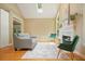 Bright living room with a fireplace, skylight, hardwood floors, and two chairs at 921 Laurel Crest Dr, Woodstock, GA 30189