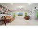 Spacious living room featuring a comfortable sofa, armchair, and a wall adorned with album art at 921 Laurel Crest Dr, Woodstock, GA 30189