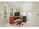 Bright home office with natural light from surrounding windows at 921 Laurel Crest Dr, Woodstock, GA 30189