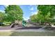 A fun community playground with slides, climbing frames, and a soft landing surface at 921 Laurel Crest Dr, Woodstock, GA 30189