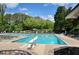 A refreshing community pool with diving board and comfortable lounge chairs for relaxing and enjoying the summer sun at 921 Laurel Crest Dr, Woodstock, GA 30189