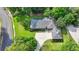 Charming home nestled among mature trees, with a well-manicured lawn and an expansive driveway at 1758 N Springs Dr, Atlanta, GA 30338