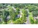 An aerial view of a single-Gathering home surrounded by mature trees and well-manicured lawn at 1758 N Springs Dr, Atlanta, GA 30338