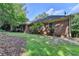Lush backyard featuring manicured lawn and a brick home exterior at 1758 N Springs Dr, Atlanta, GA 30338