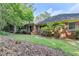 Lush backyard featuring manicured lawn and a brick home exterior at 1758 N Springs Dr, Atlanta, GA 30338