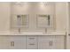 Bathroom vanity featuring double sinks, white cabinetry, and brushed gold hardware at 1758 N Springs Dr, Atlanta, GA 30338