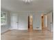 Bedroom featuring hardwood floors, modern lighting, and access to bathroom at 1758 N Springs Dr, Atlanta, GA 30338