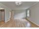 Bedroom featuring hardwood floors, natural light, and modern lighting fixture at 1758 N Springs Dr, Atlanta, GA 30338