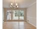Elegant dining room with hardwood floors, large windows, and neutral walls at 1758 N Springs Dr, Atlanta, GA 30338
