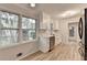 Kitchen featuring white cabinets, neutral countertops, stainless steel appliances, and hardwood floors at 1758 N Springs Dr, Atlanta, GA 30338