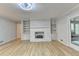 Large living room with hardwood floors and painted brick fireplace at 1758 N Springs Dr, Atlanta, GA 30338