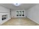 Spacious living room with hardwood floors and a brick fireplace at 1758 N Springs Dr, Atlanta, GA 30338