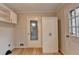 Mud room with a door to outside and closet, hardwood floors at 1758 N Springs Dr, Atlanta, GA 30338