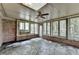 Bright sunroom features brick walls, many windows, skylights, and stone floors at 1758 N Springs Dr, Atlanta, GA 30338