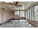 Bright sunroom features brick walls, many windows, skylights, and stone floors at 1758 N Springs Dr, Atlanta, GA 30338