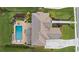 Stunning aerial view of a home with a backyard oasis featuring a pool, spa, and manicured landscaping at 2377 Kesgrove Way, Buford, GA 30518