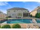 The backyard features a refreshing pool and an inviting porch perfect for relaxation and outdoor enjoyment at 2377 Kesgrove Way, Buford, GA 30518