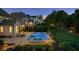 Backyard view featuring a sparkling pool, hot tub, and mature trees providing a private outdoor retreat at 2377 Kesgrove Way, Buford, GA 30518