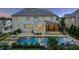 Stunning backyard features a large pool with in-pool loungers, spa, and a screened porch for outdoor entertaining at 2377 Kesgrove Way, Buford, GA 30518