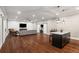 Finished basement featuring a recreation area, entertainment center and bar area with hardwood floors at 2377 Kesgrove Way, Buford, GA 30518