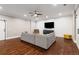 Finished basement featuring an entertainment center and large sectional sofa for recreation and relaxation at 2377 Kesgrove Way, Buford, GA 30518