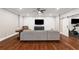 Finished basement featuring an entertainment center and large sectional sofa for recreation and relaxation at 2377 Kesgrove Way, Buford, GA 30518