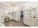 A bright bathroom vanity area showcases dual mirrors and sleek fixtures at 2377 Kesgrove Way, Buford, GA 30518