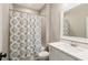 Bathroom featuring a shower with a patterned curtain and a vanity with a modern sink at 2377 Kesgrove Way, Buford, GA 30518