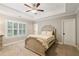 Bedroom with trey ceiling and shuttered window at 2377 Kesgrove Way, Buford, GA 30518