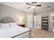 Comfortable bedroom with a king bed, neutral colors, and easy access to the ensuite bathroom at 2377 Kesgrove Way, Buford, GA 30518