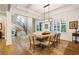 Elegant dining room with hardwood floors, contemporary chandelier and view of staircase at 2377 Kesgrove Way, Buford, GA 30518