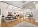 Spacious dining room area with hardwood floors, stylish furniture, and abundant natural light at 2377 Kesgrove Way, Buford, GA 30518