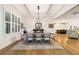 Elegant dining room featuring hardwood floors, plantation shutters, and sophisticated decor at 2377 Kesgrove Way, Buford, GA 30518