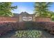 Stone sign and manicured landscape marking the entrance to the desirable community, 