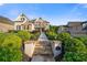 Inviting home featuring a stone walkway, lush landscaping, and great curb appeal at 2377 Kesgrove Way, Buford, GA 30518