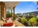 Cozy front porch with comfortable seating, potted plants, and a serene view of the landscaped yard at 2377 Kesgrove Way, Buford, GA 30518