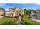 Beautifully landscaped front yard with lush greenery, stone accents, and manicured lawn at 2377 Kesgrove Way, Buford, GA 30518