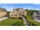 Beautifully landscaped front yard with lush greenery, stone accents, and manicured lawn at 2377 Kesgrove Way, Buford, GA 30518