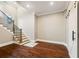 A hallway with hardwood floors, staircase, barn door and elegant finishes at 2377 Kesgrove Way, Buford, GA 30518